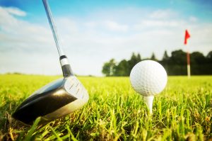 Playing golf. Club and ball on tee Playing golf. Club and ball on tee